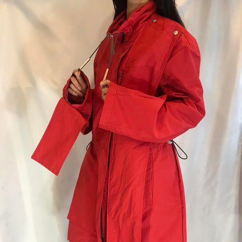 A-COLD-WALL abstract red long raincoat with detachable decorative fabric strips to customise the pie