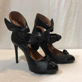 Marco de Vincenzo black leather closed-toe heels with tiered bows up to the ankle
